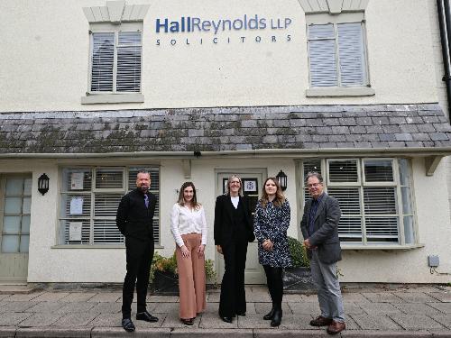 Four people standing in front of a house, Hall Reynolds solicitors, full body, Cllr George Cowcher
