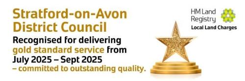 Gold Standard award banner with golden and black wording and a golden star local land charges,